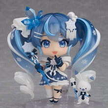 Load image into Gallery viewer, A Nendoroid figure of Snow Miku designed by nekoneko, featuring blue hair, white and blue snowflake-themed clothing, and accessories such as a wand and decorative elements.
